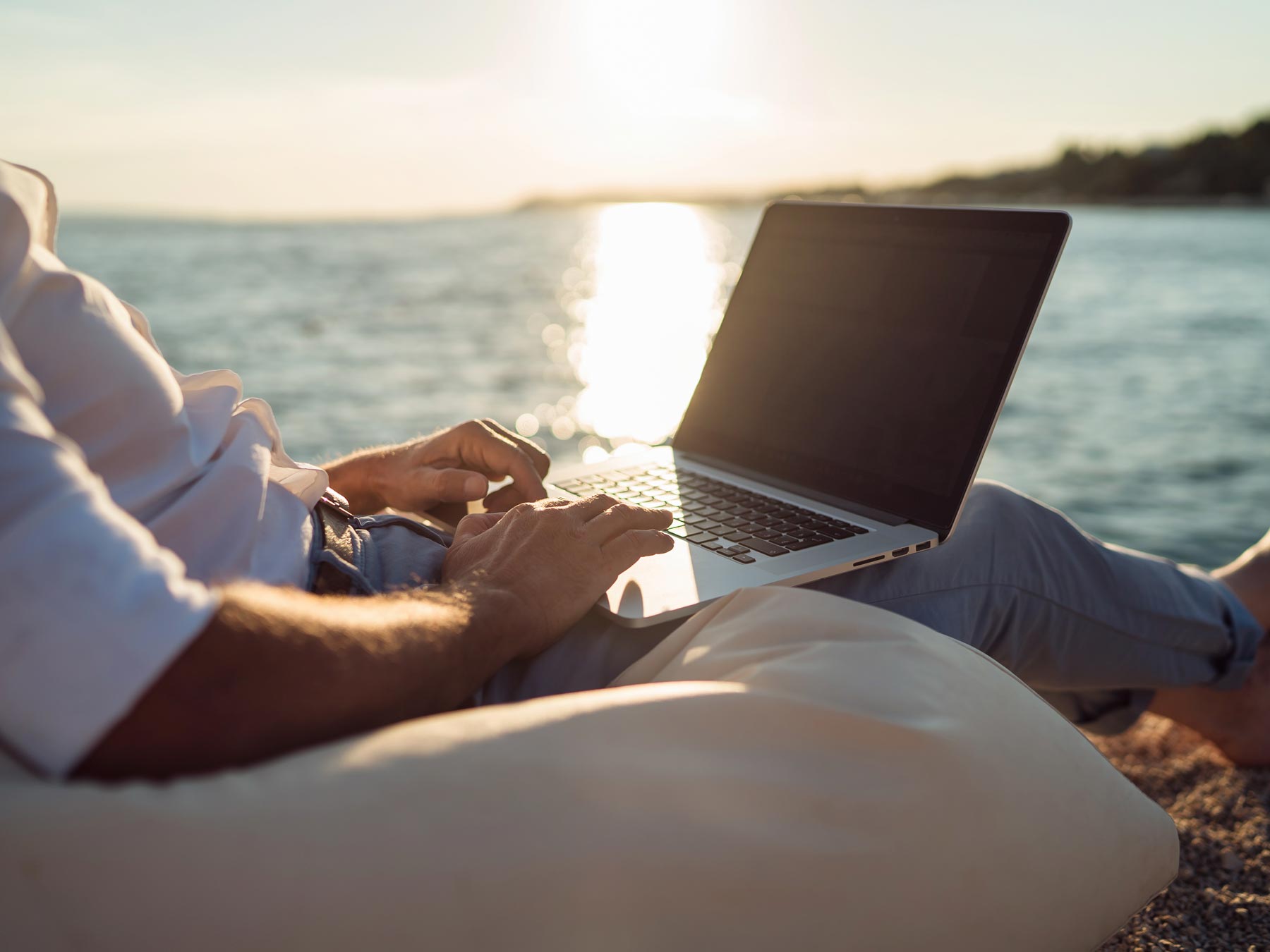 hero man laptop beach shutterstock 736958413
